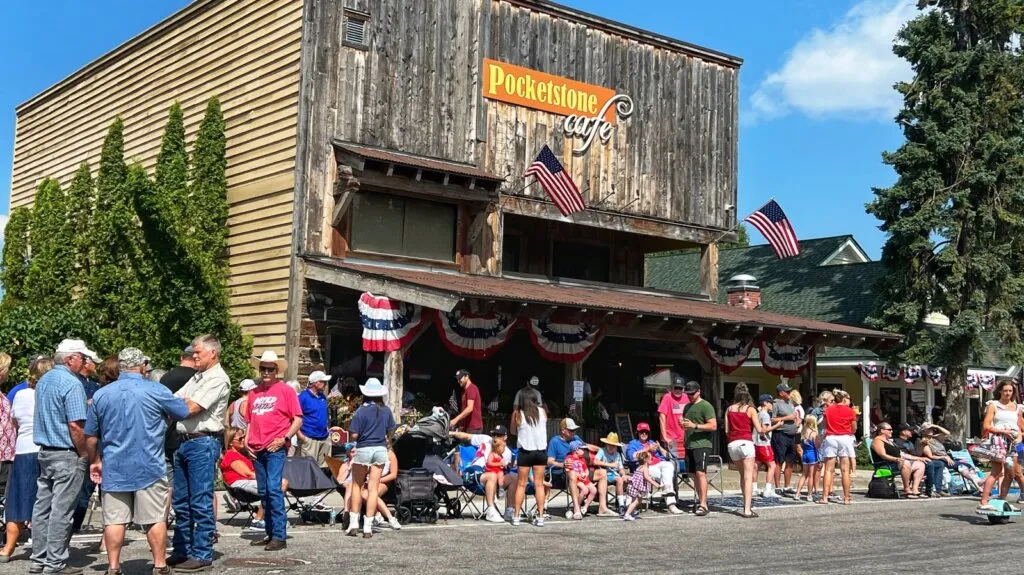 Bigfork, Montana, and the Pocketstone Cafe on July 4th waiting for the parade. Credit: gatherandgotravel.com