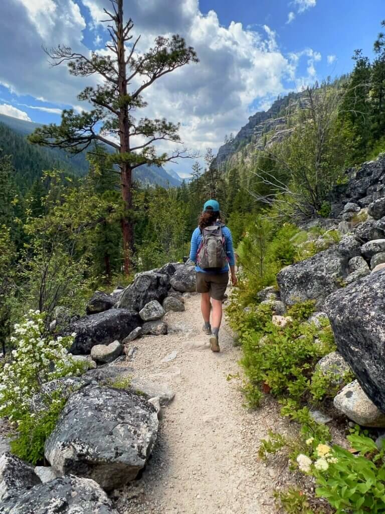 Woman on the Blodgett Canyon Overlook trail in Montana in the Bitterroot National Forest. Credit: Gatherandgotravel.com